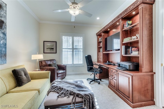 home office featuring light carpet, ceiling fan, baseboards, and crown molding