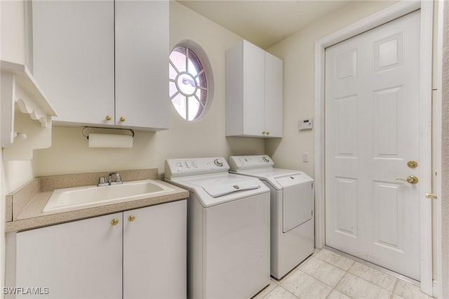 clothes washing area with independent washer and dryer, cabinet space, a sink, and light tile patterned floors