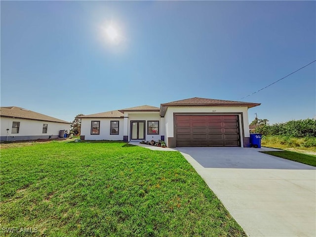 view of front of home with a garage and a front yard