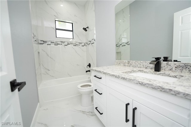 full bathroom featuring tiled shower / bath combo, vanity, and toilet