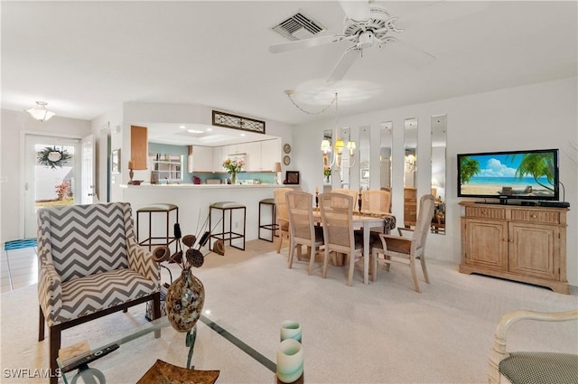 4261 Ute Ct, Estero, FL 33928 - dining space featuring ceiling fan with notable chandelier, visible vents, and light colored carpet