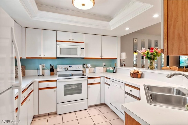 4261 Ute Ct, Estero, FL 33928 - kitchen with white cabinets, white appliances, light countertops, and a raised ceiling