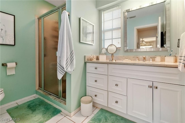 4261 Ute Ct, Estero, FL 33928 - full bathroom featuring toilet, a shower stall, vanity, baseboards, and tile patterned floors