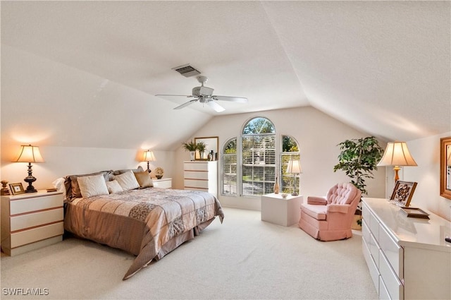 4261 Ute Ct, Estero, FL 33928 - bedroom featuring light carpet, visible vents, a ceiling fan, lofted ceiling, and a textured ceiling