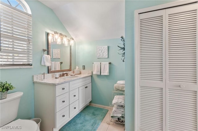 4261 Ute Ct, Estero, FL 33928 - bathroom featuring lofted ceiling, a closet, toilet, vanity, and tile patterned flooring