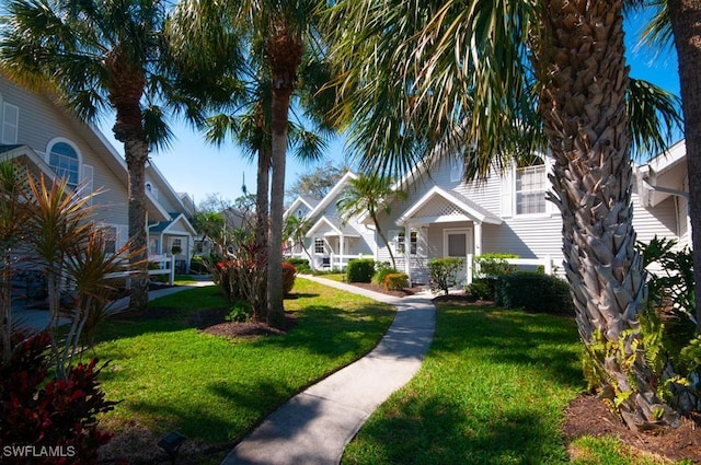 view of property's community featuring a yard