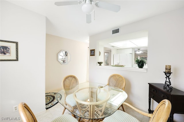 dining area with visible vents and a ceiling fan