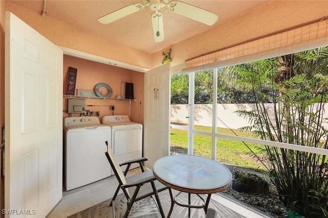 interior space with laundry area, separate washer and dryer, and a ceiling fan