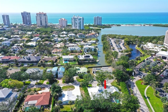 bird's eye view featuring a water view and a city view