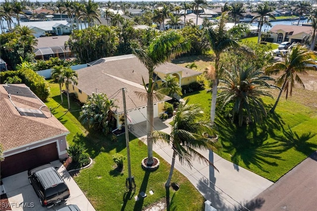 aerial view featuring a water view and a residential view