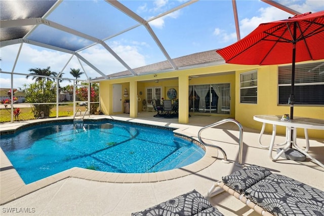 pool with a patio area, a lanai, and a ceiling fan