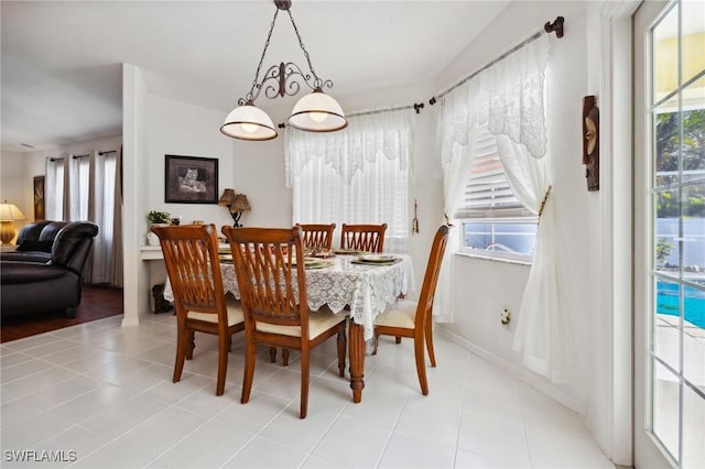 tiled dining space with baseboards