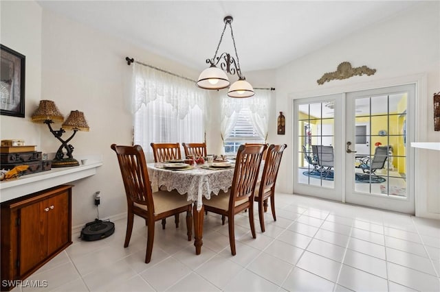 dining area featuring light tile patterned floors and french doors