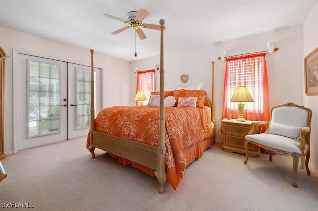 bedroom with access to exterior, french doors, light colored carpet, and a ceiling fan