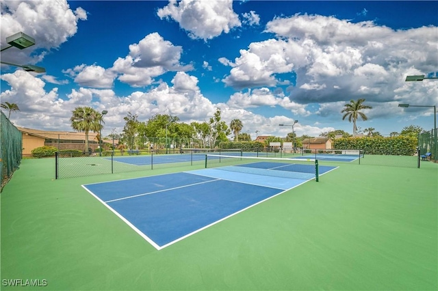 view of tennis court with fence