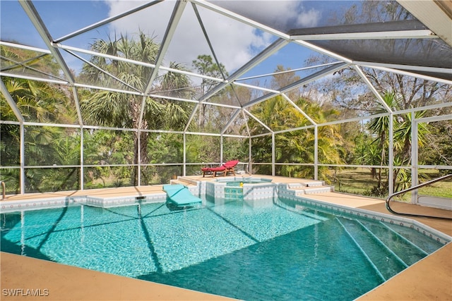 view of swimming pool with an in ground hot tub and glass enclosure