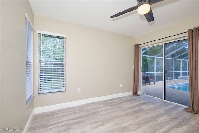 spare room with ceiling fan and light hardwood / wood-style flooring