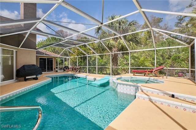 view of swimming pool with a patio, area for grilling, an in ground hot tub, and glass enclosure