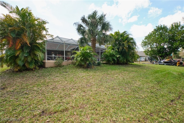 view of yard featuring a lanai