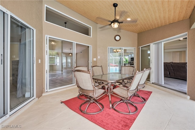 exterior space featuring lofted ceiling, ceiling fan, and wooden ceiling