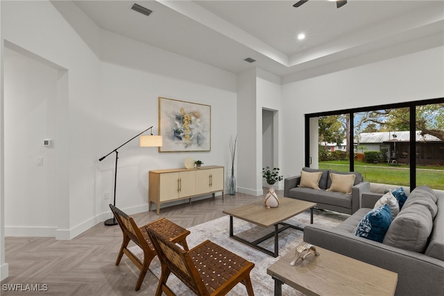 living room featuring recessed lighting, visible vents, and baseboards