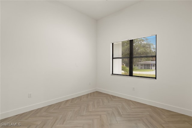 empty room featuring baseboards