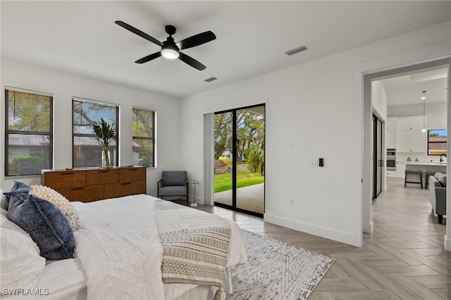 bedroom featuring access to outside, visible vents, baseboards, and ceiling fan