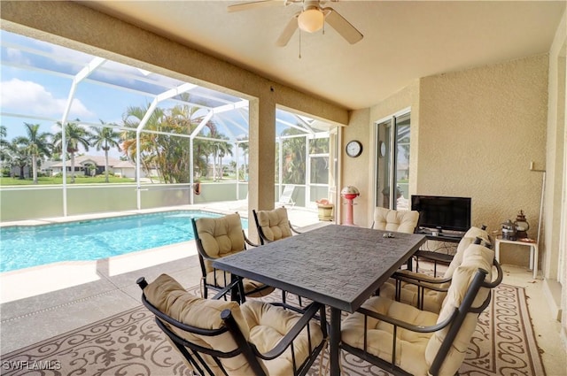 exterior space featuring glass enclosure and a patio area