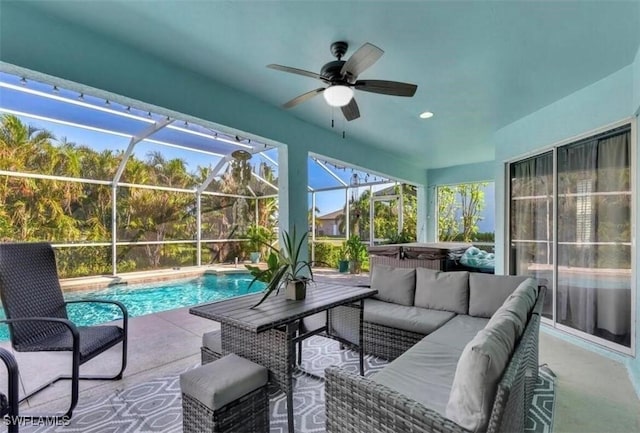 sunroom / solarium featuring ceiling fan