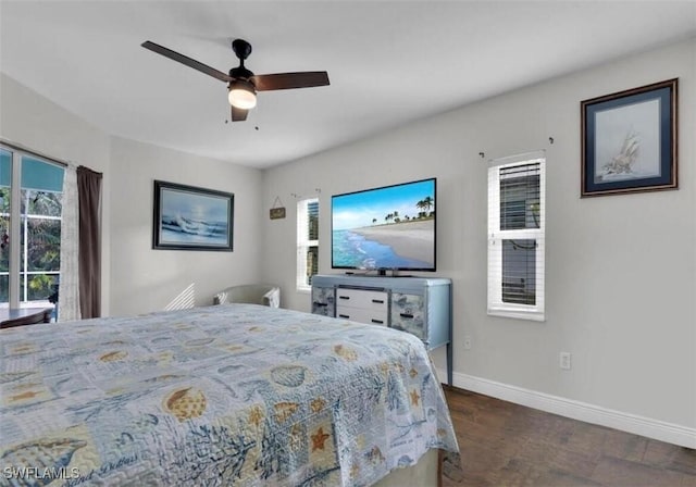 bedroom featuring dark wood-type flooring, access to exterior, and ceiling fan