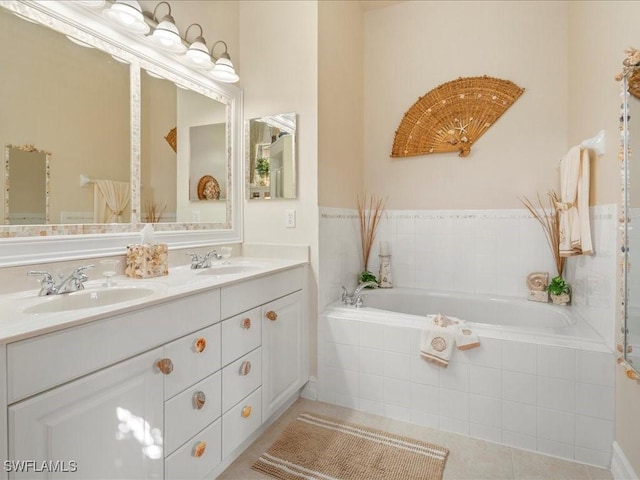 full bathroom with a garden tub, double vanity, tile patterned flooring, and a sink