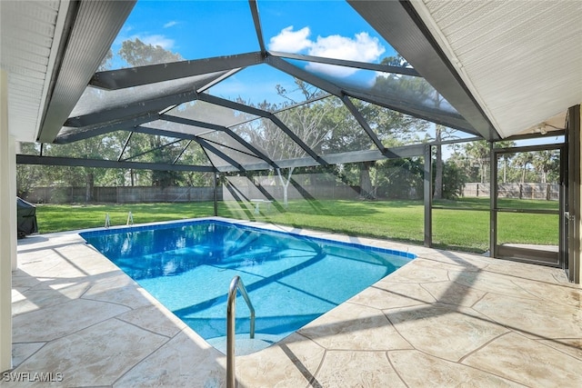 pool featuring a patio, a yard, a fenced backyard, and a lanai