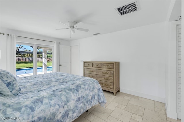 bedroom with access to exterior, visible vents, baseboards, stone tile flooring, and a ceiling fan