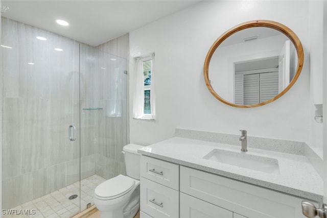 bathroom with vanity, toilet, recessed lighting, and a stall shower