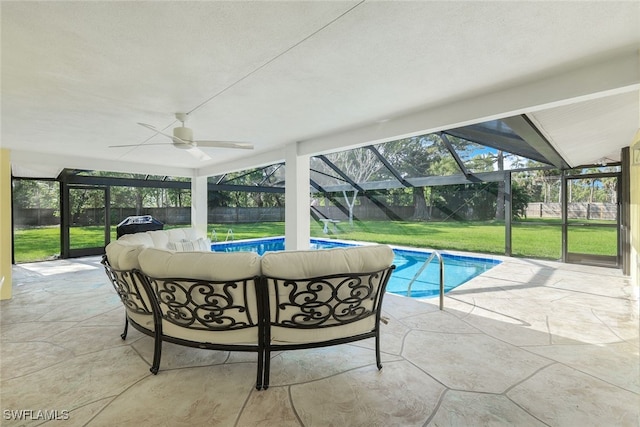 outdoor pool with glass enclosure, a yard, a fenced backyard, a patio area, and an outdoor hangout area