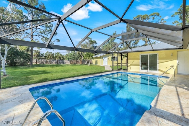 outdoor pool featuring a lanai, a lawn, and a patio