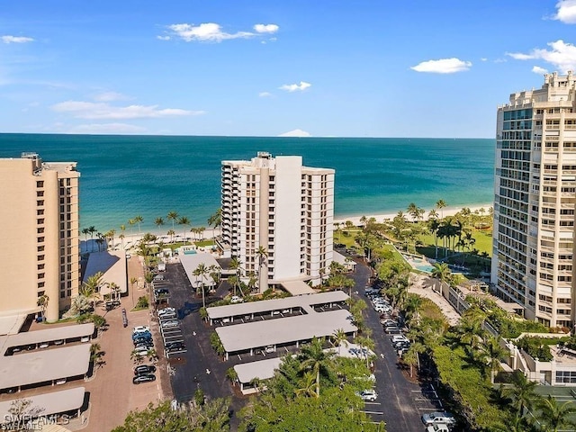 aerial view featuring a water view and a beach view