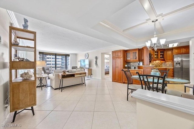 living room featuring a notable chandelier, light tile patterned floors, crown molding, and coffered ceiling