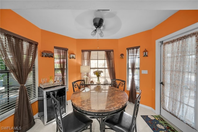 dining area featuring light tile patterned flooring and ceiling fan