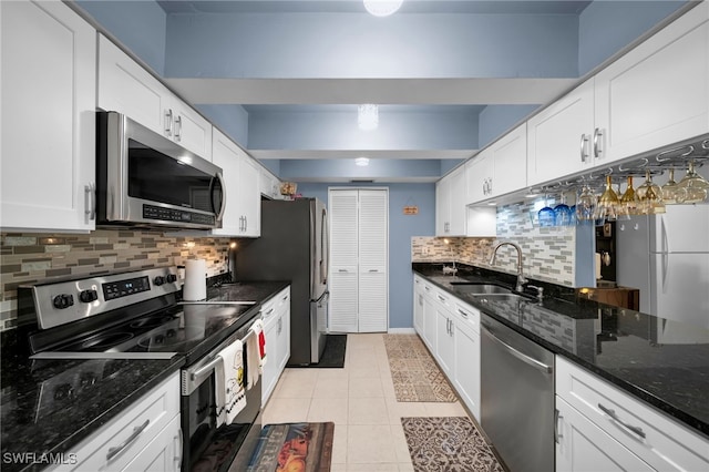 kitchen featuring sink, white cabinets, and appliances with stainless steel finishes