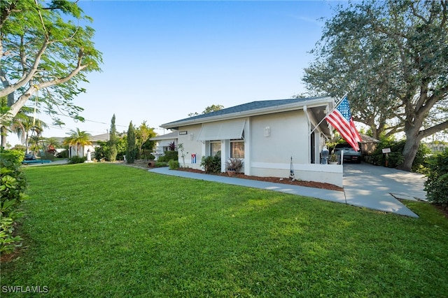 rear view of house with a yard