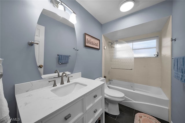 full bathroom with tiled shower / bath combo, vanity, tile patterned floors, and toilet