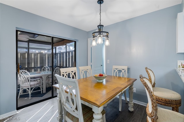 dining space featuring baseboards