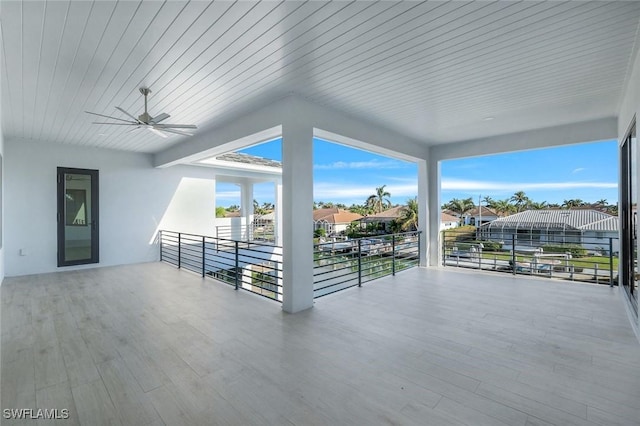 view of patio / terrace featuring ceiling fan and a residential view