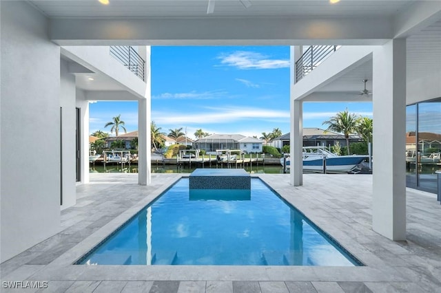 view of pool featuring a residential view and a water view