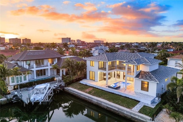 aerial view at dusk with a water view