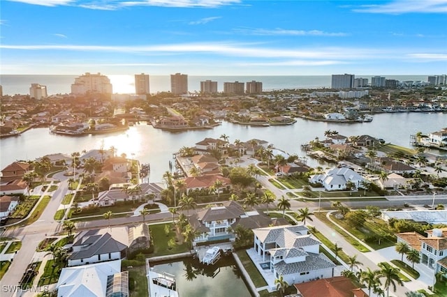 bird's eye view featuring a water view and a city view