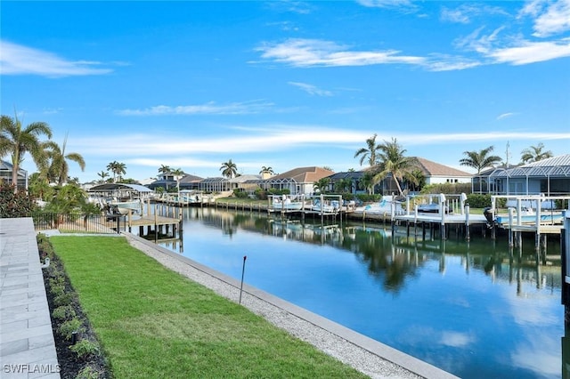 exterior space with a boat dock, boat lift, and a residential view