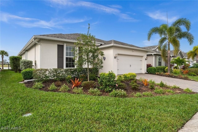 view of front of home featuring a front lawn and a garage