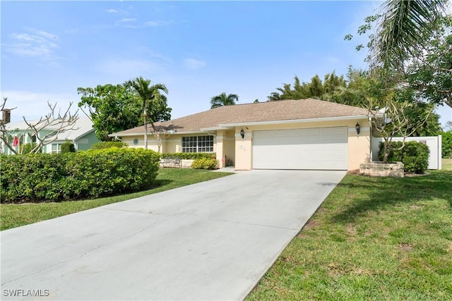 single story home with an attached garage, a front yard, concrete driveway, and stucco siding